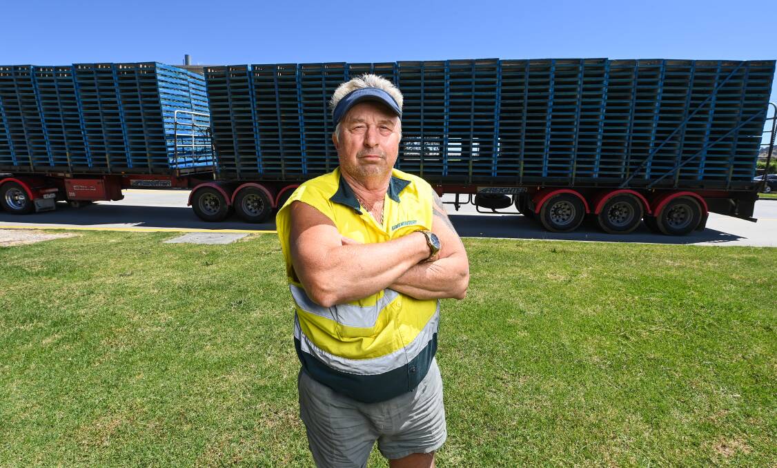 Truck driver Ken Rowston at Vitasoy with the last load of pallets to exit Corryong's timber mill following production ending at the plant. Picture by Mark Jesser