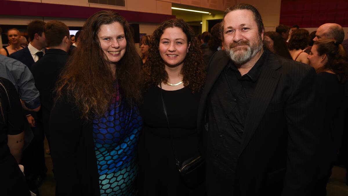 Worthy individual: Darlene Knights (centre), 17, with parents Tammy and Cam was nominated for the community service award for commitments ranging from face painting to developing a new logo for the RED Carpet Awards. Picture: MARK JESSER 