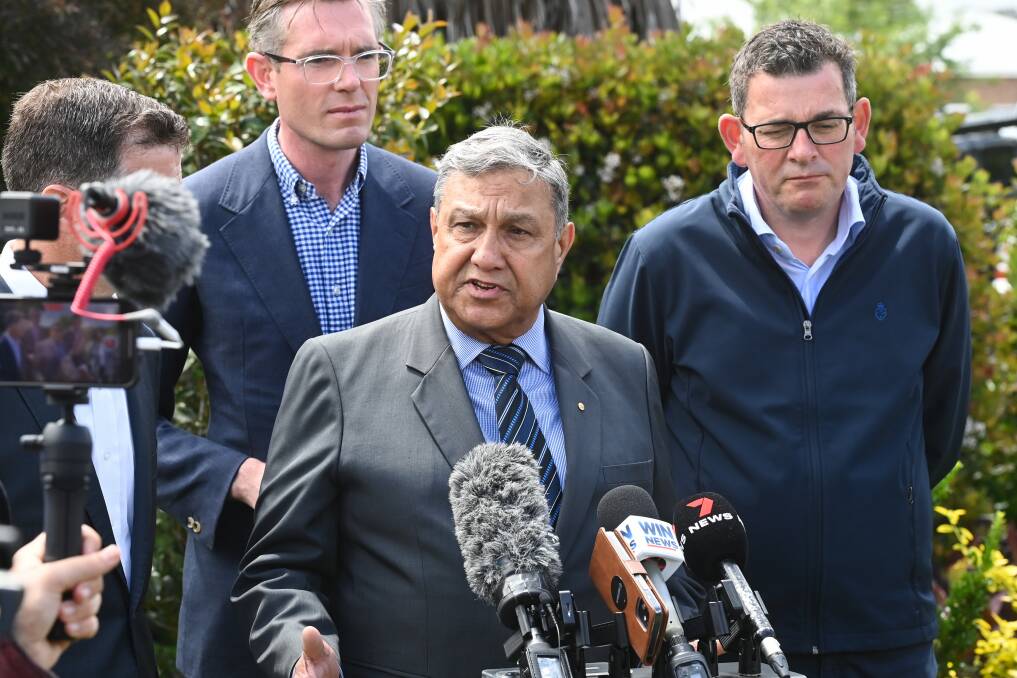 Albury Wodonga Health chairman Matt Burke addresses the media while flanked by Albury MP Justin Clancy (obscured), NSW Premier Dominic Perrottet and Victorian Premier Daniel Andrews last Thursday. Picture by Mark Jesser