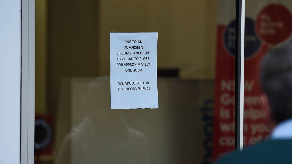 Explanation: The sign put at the entrance of Service NSW to alert clients to the closure.