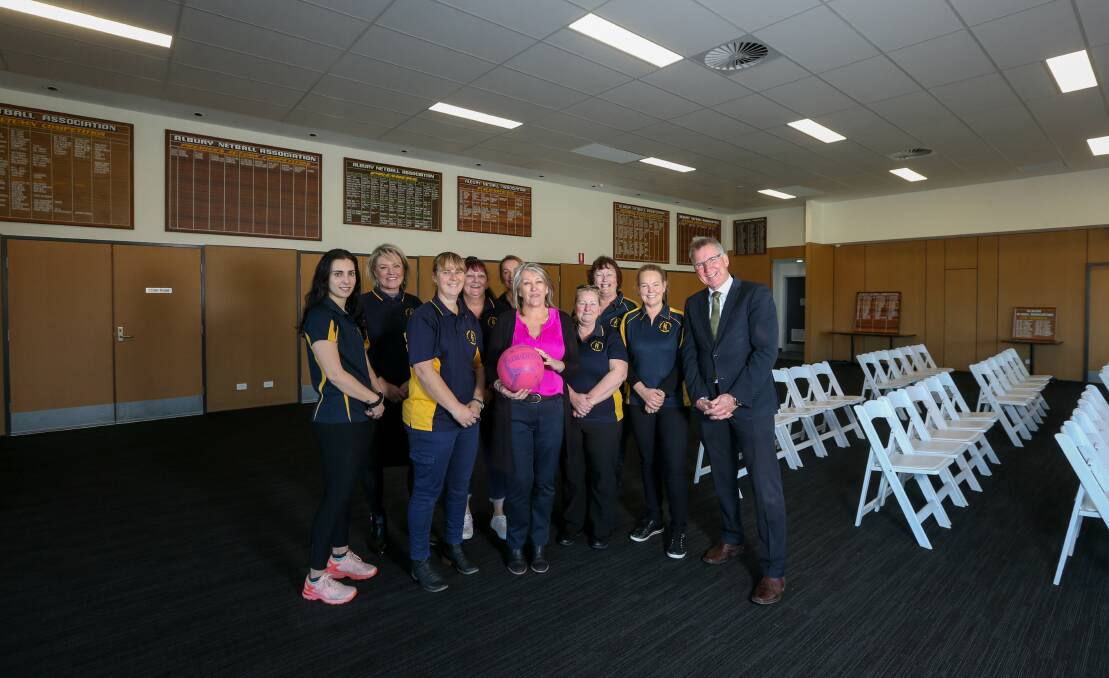 Hooray: Netball association committee members with Linda Barclay-Hales holding the ball join mayor Kevin Mack in the new clubhouse. Picture: TARA TREWHELLA