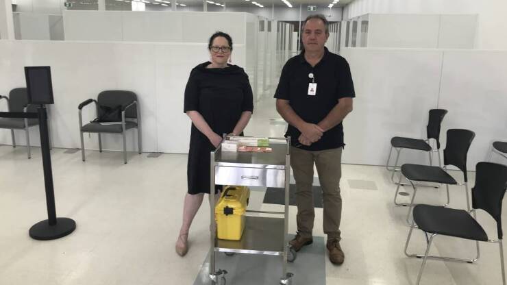 Albury Wodonga Health chief operating officer Emma Poland with the organisation's then director of infrastructure Phillip Todhunter at the Wodonga COVID vaccination hub in 2021.