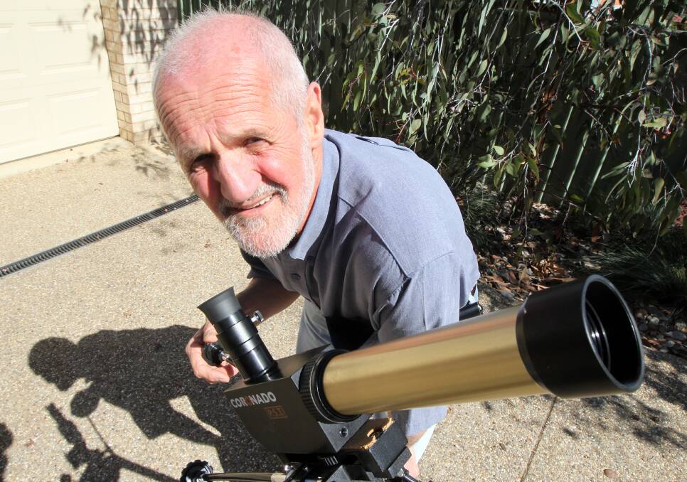 Flashback: David Thurley pictured in November 2012 with a telescope, before he travelled to Cairns for a solar eclipse which saw him miss an Albury Council meeting.
