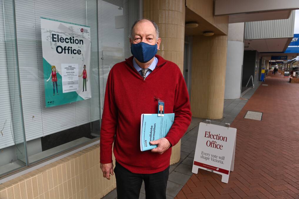 Different approach: Wodonga Council election returning officer Trevor Deacon in front of the High Street office window where the ballot draw will be posted. The premises once housed an ANZ bank branch. Picture: MARK JESSER