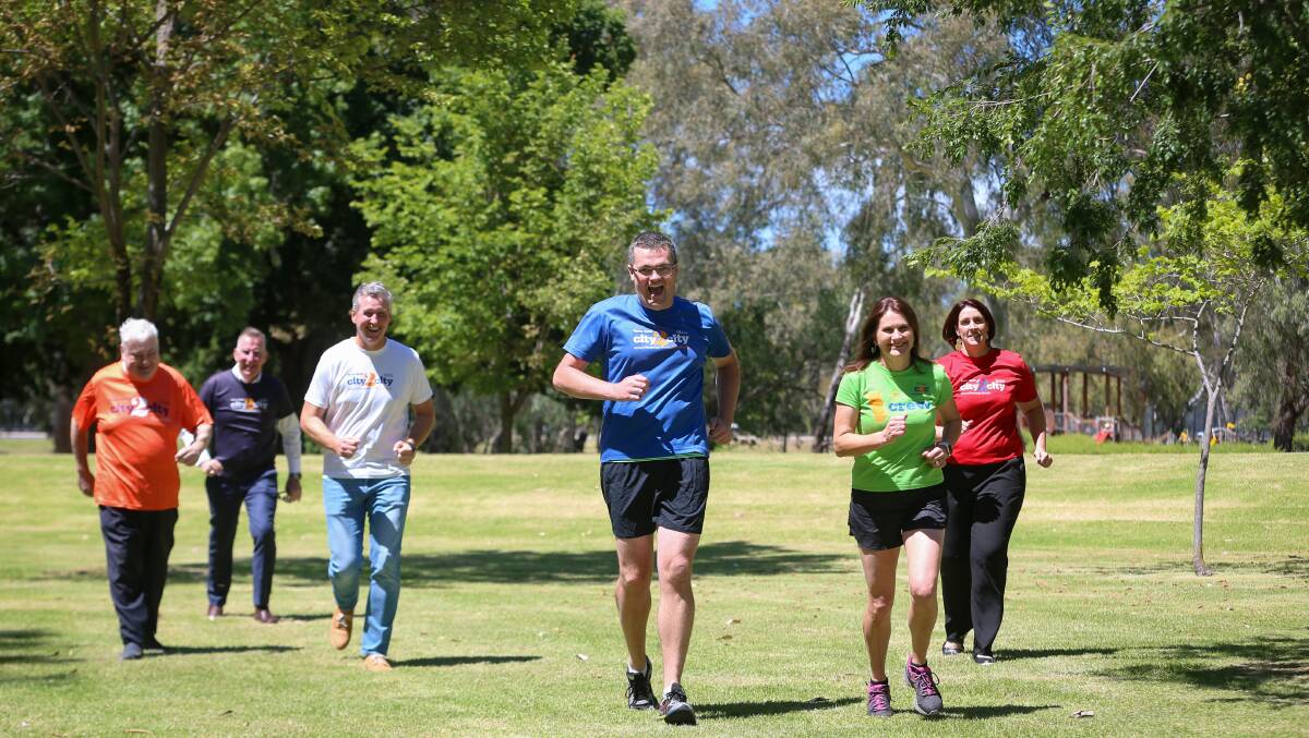 Off and running: Michael Kalimnios, Albury mayor Kevin Mack, Stephen Capello, Kev Poulton, Michelle Hudson and Leisa Bridges gear up for City2City at a launch for the event on Friday morning. Picture: JAMES WILTSHIRE