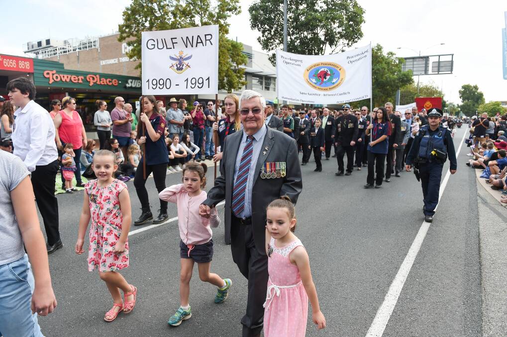 On the march: Veterans and their families parade down High Street in last month's Anzac Day commemorations in Wodonga. Next year roadworks will result in the grand walk being transferred to Hume Street.
