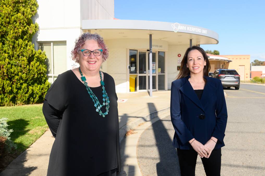 Out of the shadows: Robyn Gillis and Jaclyn Symes in front of the existing Kerferd Unit for mental health patients in Wangaratta. The government has committed to replacing it with a bigger hub. Picture: MARK JESSER
