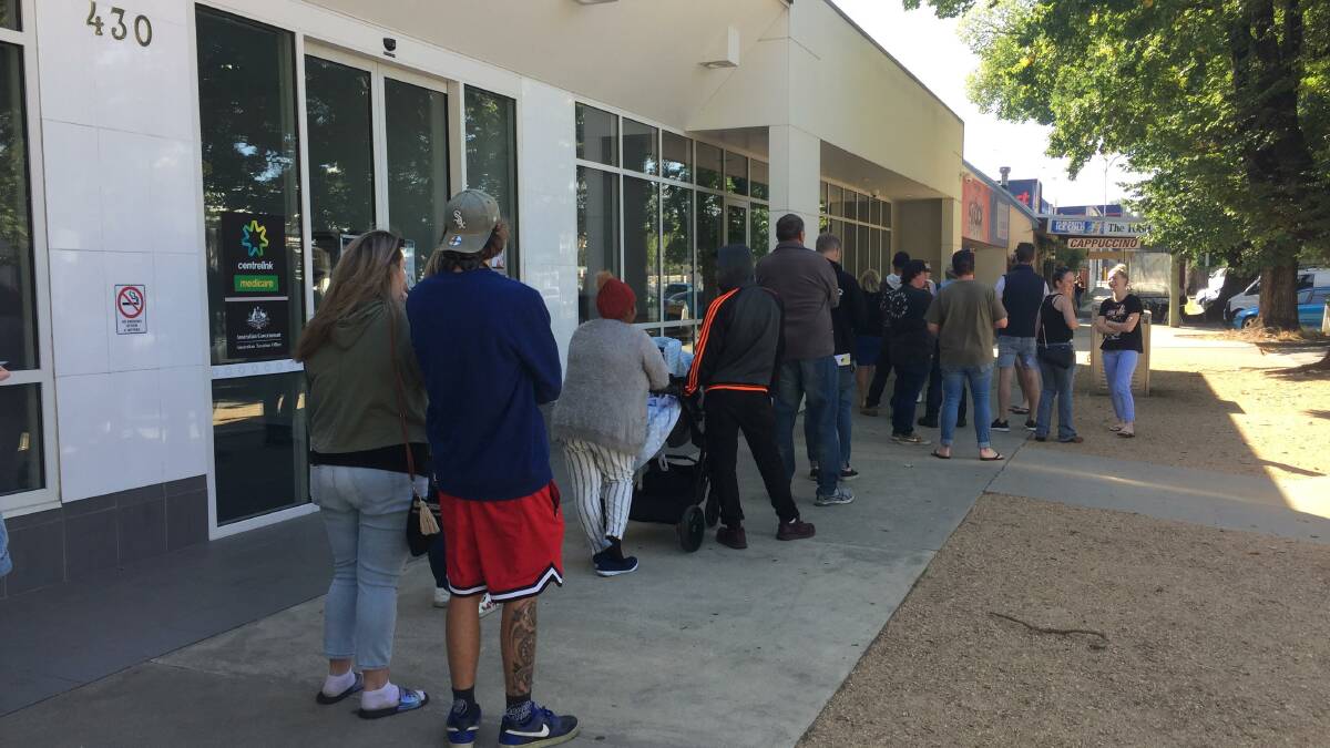Line-up: The queue outside Albury's Centrelink on Monday morning following the announcement of large-scale lockdowns in NSW and Victoria.