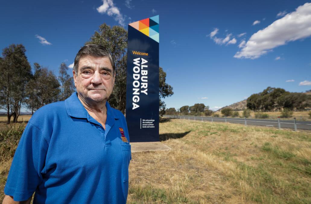 Not happy: Ian Deegan at the new entry sign on the Hume Freeway near the Logic industrial hub. He believes it should state Wodonga Albury. Picture: JAMES WILTSHIRE