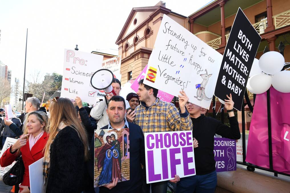 In opposition: Pro-life advocates rally outside Parliament House in Sydney ahead of debate over the decriminalisation of abortion in NSW.