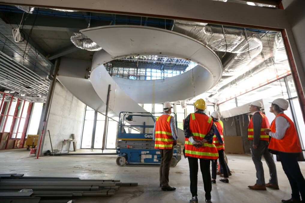 Taking shape: A spiral staircase which will be a centrepiece of Wodonga's new library and gallery was shown off to Victorian Regional Development Minister Mary-Anne Thomas during a tour yesterday. Picture: JAMES WILTSHIRE