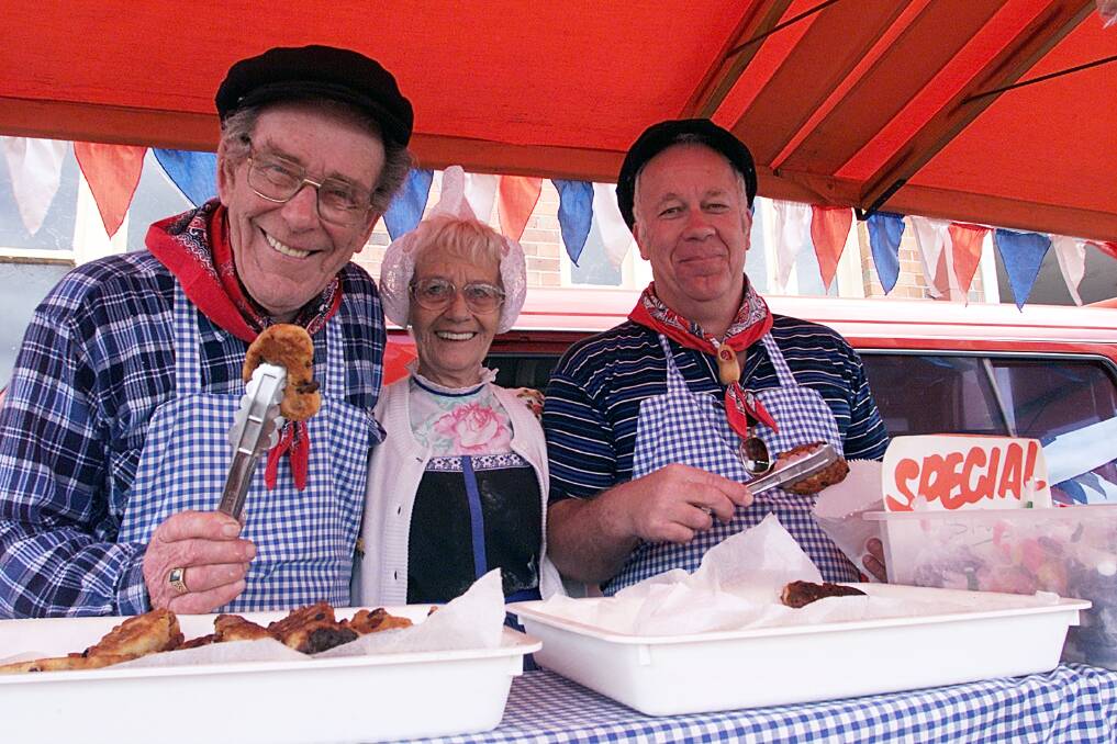 Flashback: Gerry Blom (right) with his parents Herman and Geesje at Albury's Kiewa Street market in 2002. They spent many years there selling Dutch-inspired food with funds raised helping to promote the story of the Uiver.