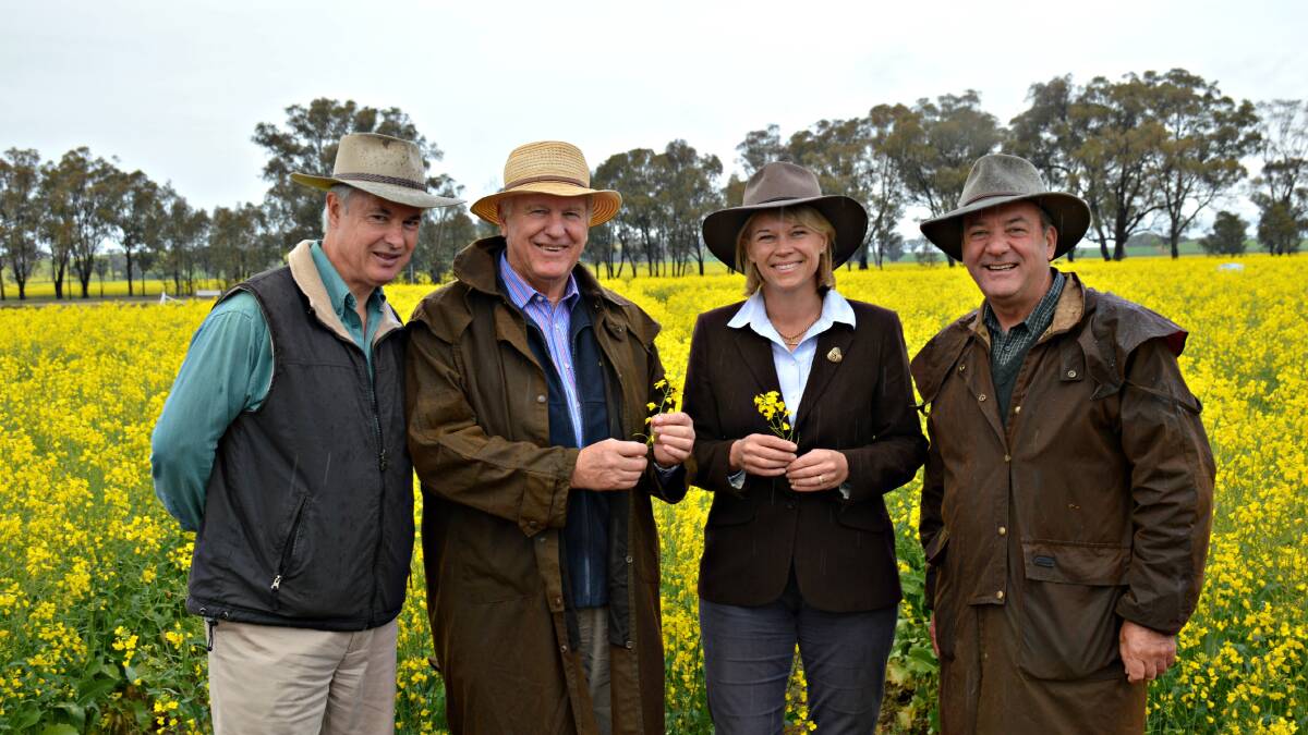 Happier times: Mr Aplin and Mr Maguire at either end with Nationals MPs Rick Colless and Katrina Hodgkinson at the 2014 Henty Machinery Field Days.