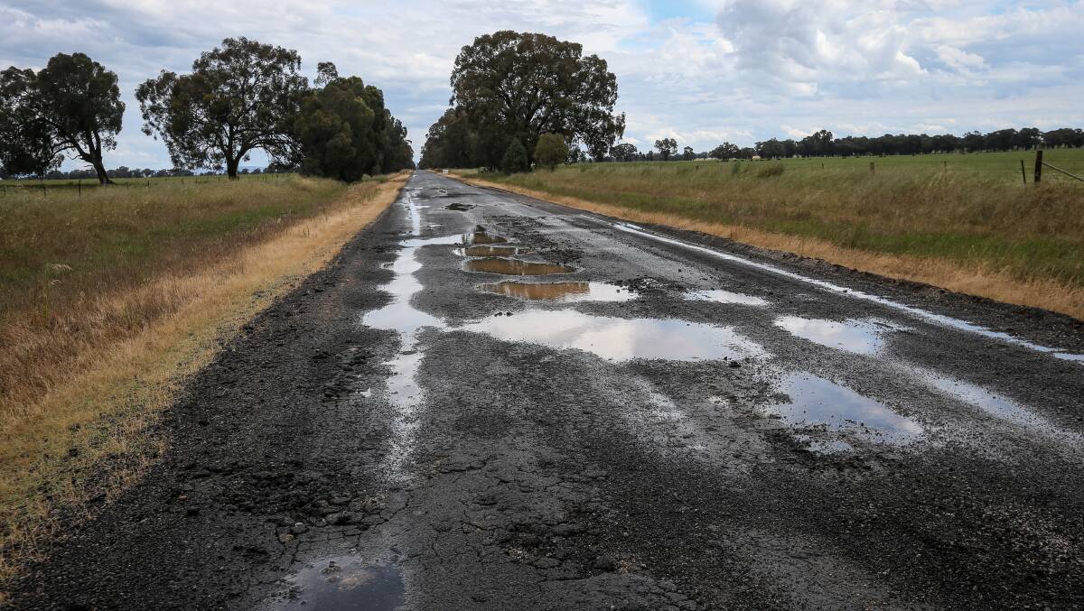 Potholes on the road from Howlong to Burrumbuttock earlier this month. Picture by James Wiltshire