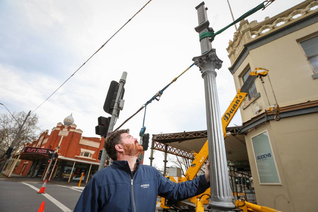 Thing's are looking up: Sodens publican Brendan Tracey with a repaired post installed on Friday. Picture: JAMES WILTSHIRE