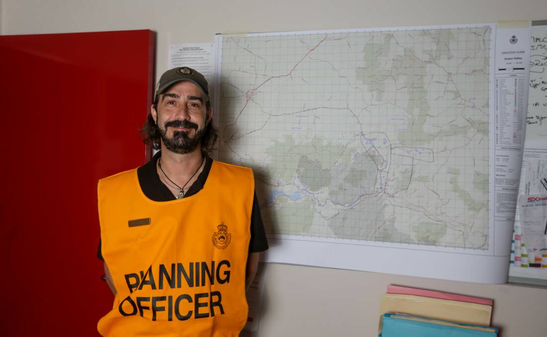 A long way from home: US firefighting strategist Nick Yturri has travelled from the mountainous state of Idaho to help at the Albury control room with planning. Picture: TARA TREWHELLA