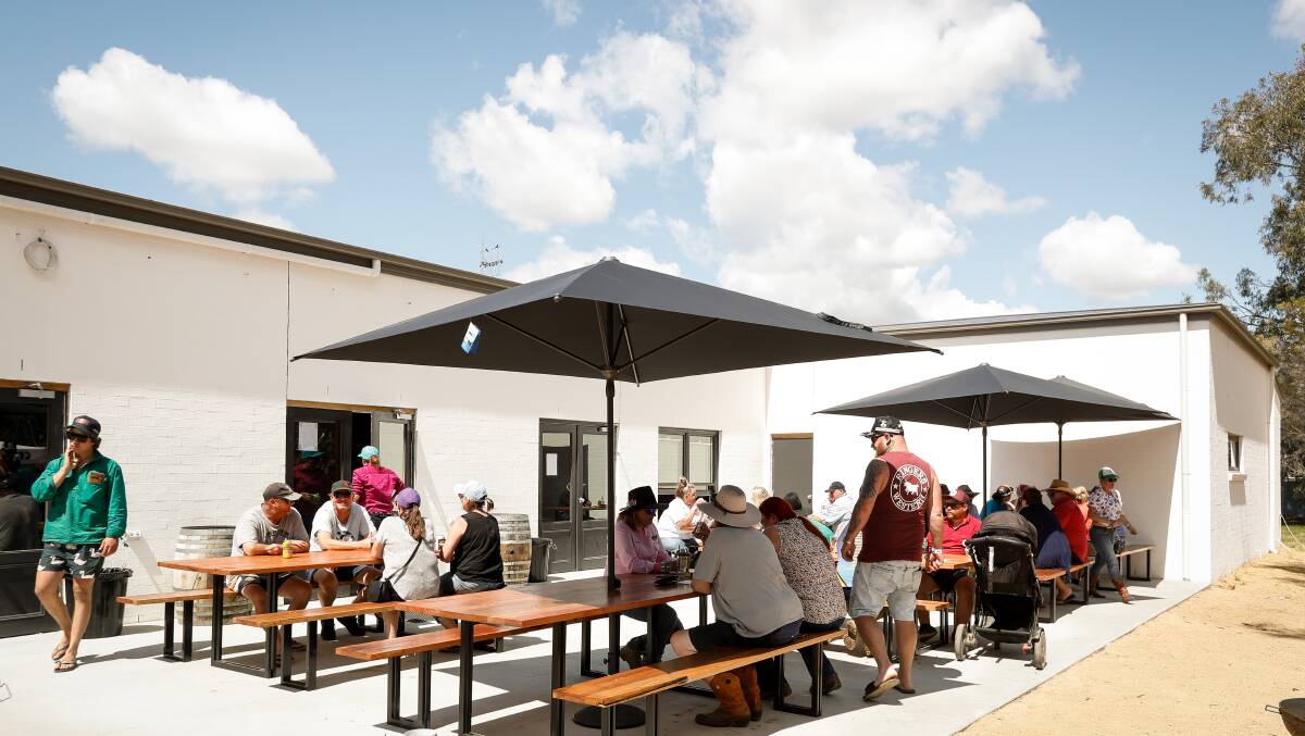 The rear outdoor dining area at the rebuilt Conargo Pub. There are plans to have a full kitchen service, but on Sunday patrons benefited from a sausage sizzle. Picture by James Wiltshire.