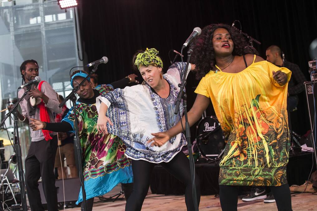 Ready to roll: The Public Opinion Afro Orchestra perform at Federation Square in Melbourne. The musicians will be at this year's Strawberry Fields Festival at Tocumwal.