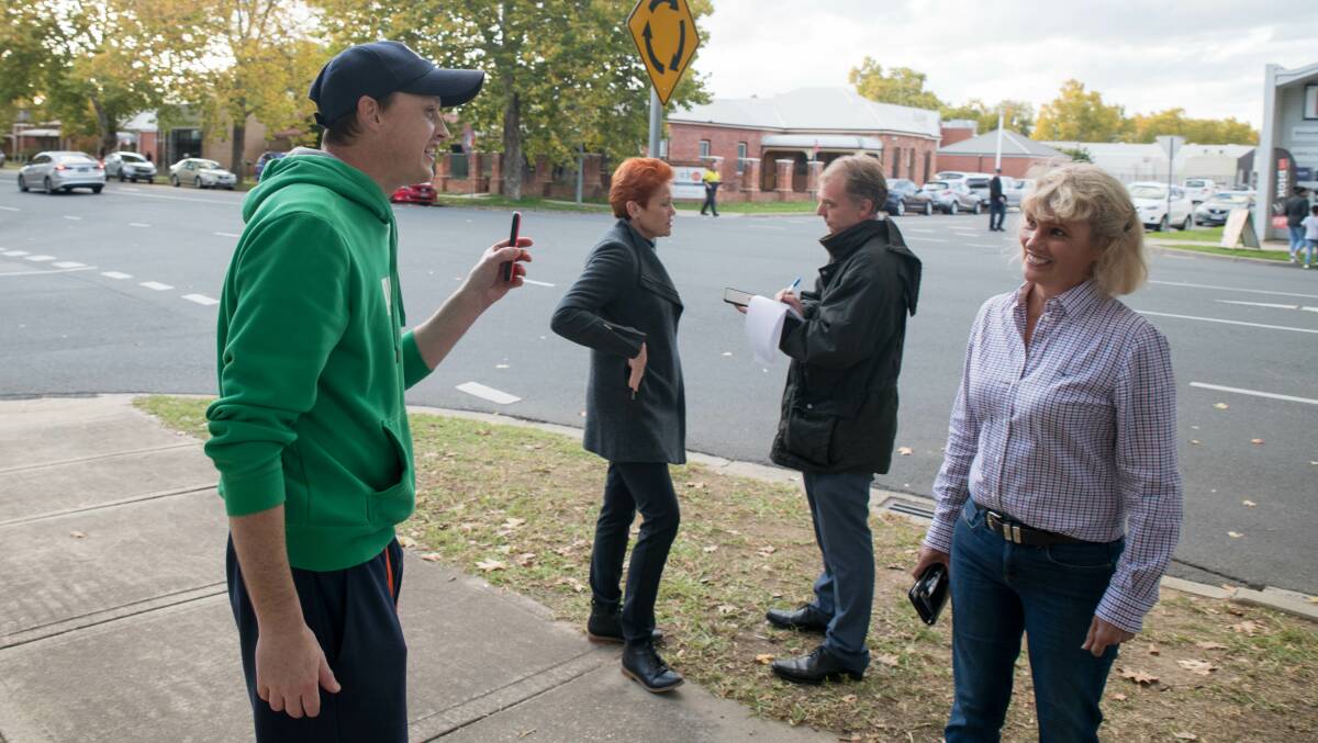 One on one: One Nation NSW senate candidate Kate McCulloch speaks to the protester as Pauline Hanson continues to answer The Border Mail's questions.Picture: TARA TREWHELLA