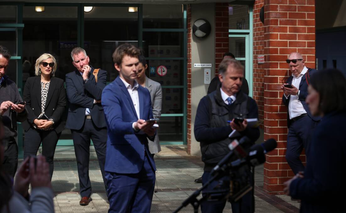 Watching on: Wodonga mayor Anna Speedie and Albury mayor Kevin Mack watch on as NSW Premier Gladys Berejiklian answers journalists' questions outside the Albury police station on Tuesday. Picture: JAMES WILTSHIRE