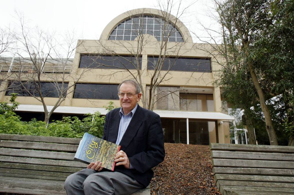 Flashback: Bruce Pennay at the Charles Sturt campus at Thurgoona in 2005 with his book about Albury-Wodonga history, Making a City in the Country.