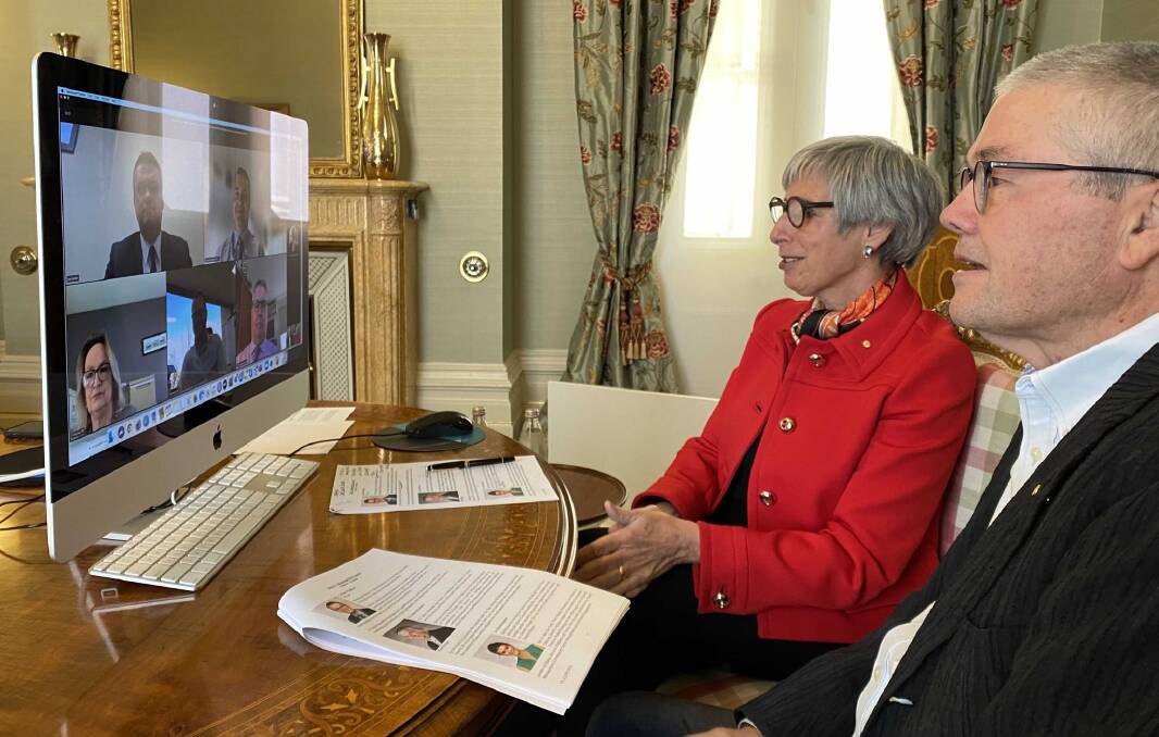 Listening: Victorian Governor Linda Dessau and her husband Anthony Howard watch Wodonga councillors with profiles of them sitting on their table. Picture: GOVERNMENT HOUSE