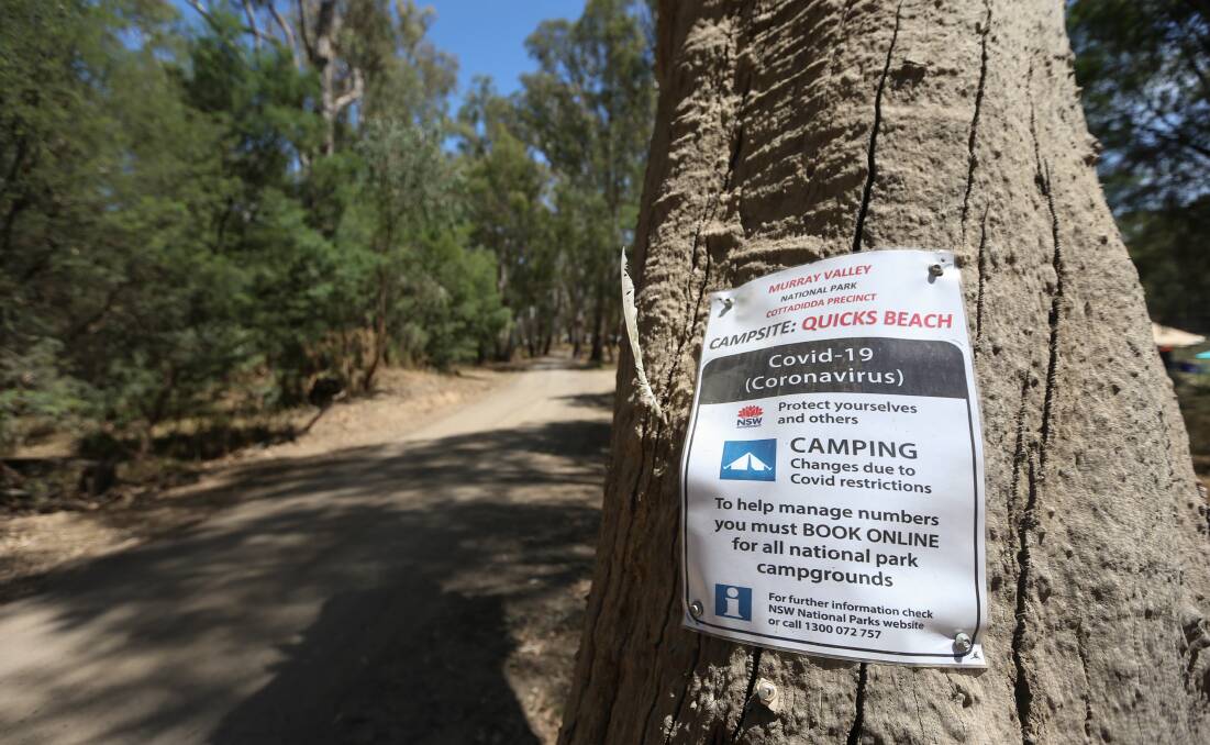 Tell-tale sign: A poster notifying visitors to Quicks Beach at Barooga that they need to book online to be able to camp there under coronavirus measures.