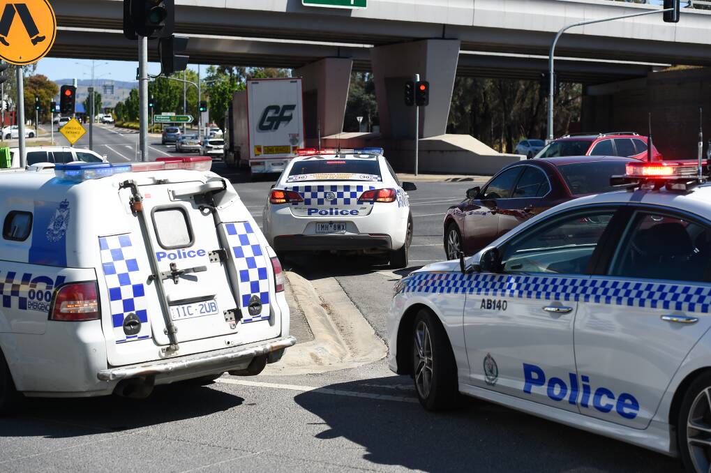 Three's a crowd: Wodonga and Albury police cars near the crashes occurred as the Lincoln Causeway approaches the Hume Freeway bridges across High Street. Picture: MARK JESSER