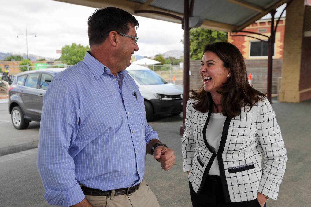 Laughing matter: Bill Tilley and Senator Jane Hume have a moment of levity on the old Wodonga railway station platform. Picture: JAMES WILTSHIRE