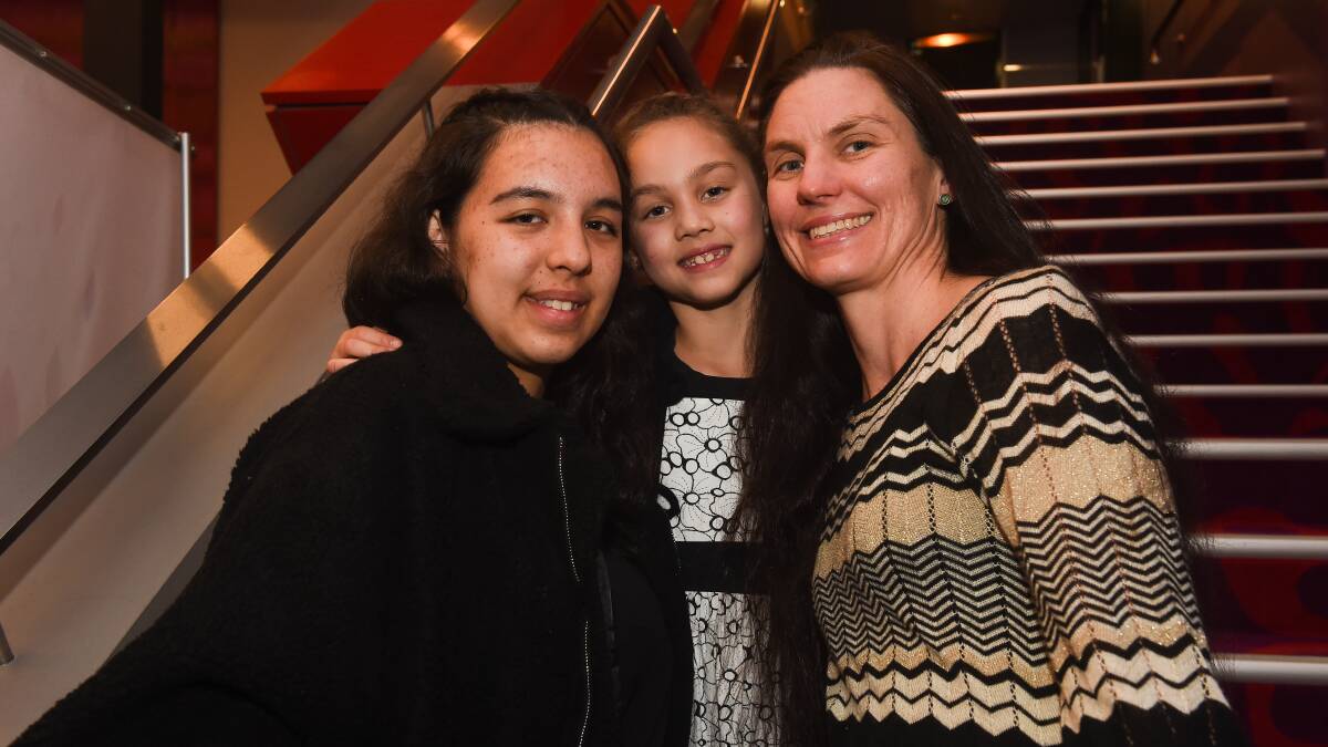Versatile nominee: Katana Tolman, 16, with her sister Layla, 8 and mother Fleur. A finalist in the learning and development award, the year 11 works at McDonald's and the ANZ Bank and attended two university winter school camps recently. Picture: MARK JESSER