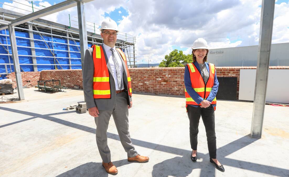 Rooftop view: Wodonga mayor Kev Poulton and Regional Development Minister Mary-Anne Thomas take in the surrounds during Tuesday's inspection of the library and gallery being constructed. Picture: JAMES WILTSHIRE