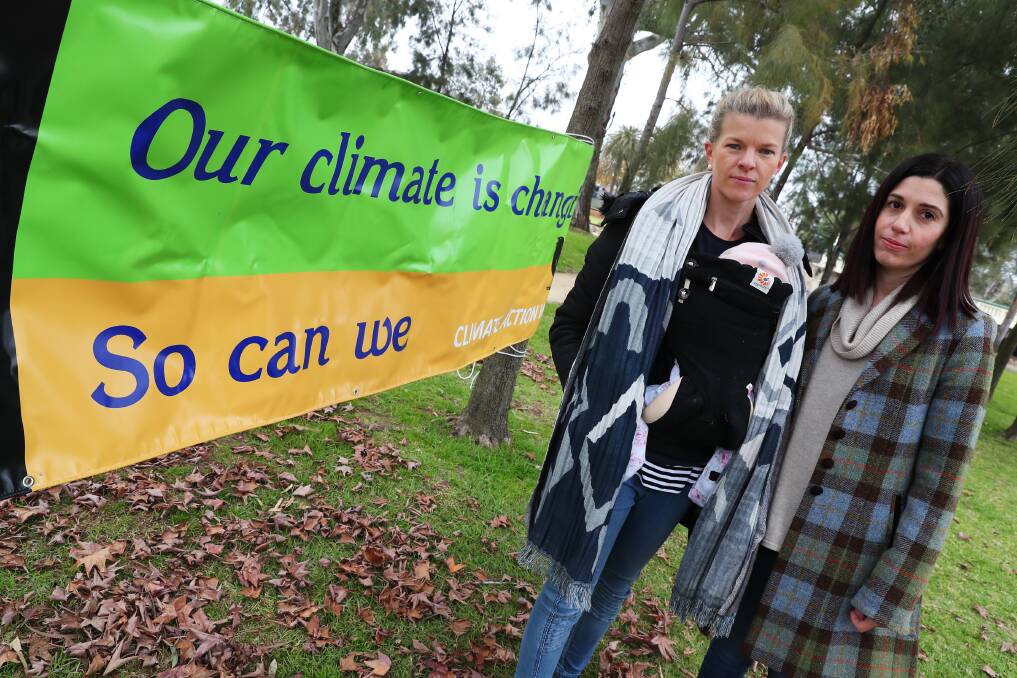 Climate campaigners: Wagga Wagga Fridays for Future members Trudi Beck and Emilie Nuck outside the Nationals leader Michael McCormack's office at Wagga. Dr Beck has written an email to Albury and other Riverina councils urging them to declare a climate emergency. Picture: DAILY ADVERTISER