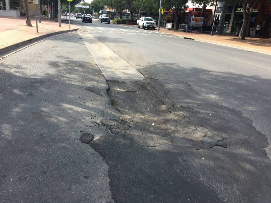 Flawed bitumen: The area of blacktop on Dean Street which Murray King referred to as a pothole and called for it to be recitfied.