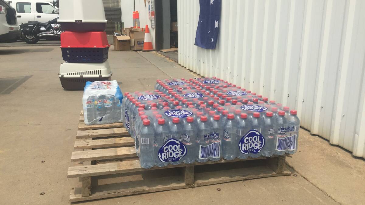 Donation: Slabs of bottled water provided to help those caught up in the fires. 