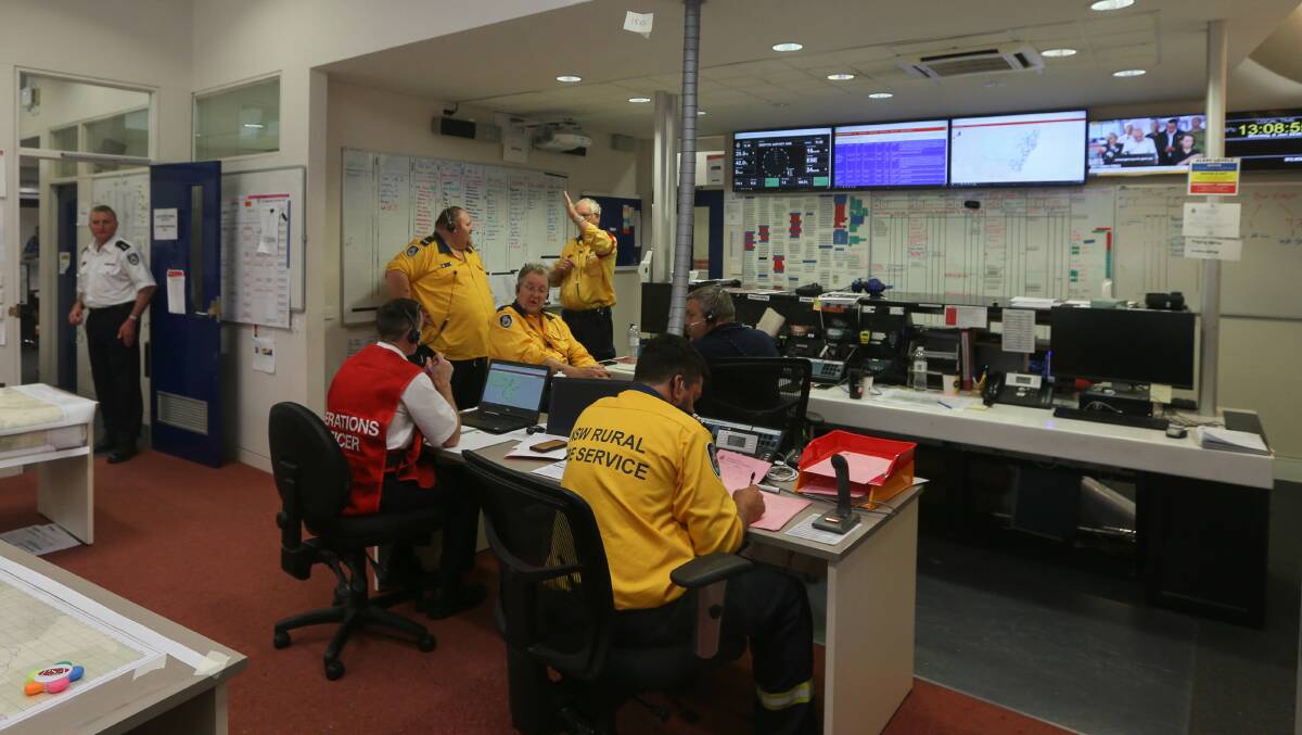 Busier than Bourke Street: Firefighters in the nerve centre of the NSW Rural Fire Service's Albury headquarters. Picture: TARA TREWHELLA 