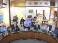 A screenshot of the video stream of the council meeting with Federation councillor David Fahey standing up and speaking to his notice of motion on a poll.