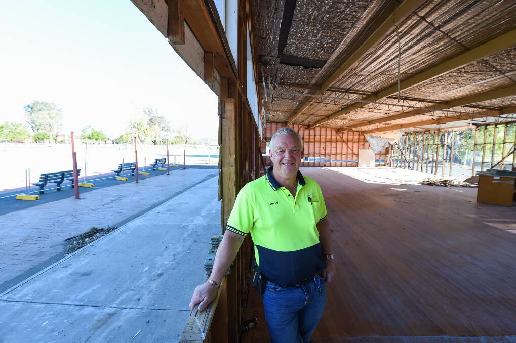 Hole lot of work: Site supervisor Hilly Westra inside the JC King Park netball pavilion which has been turned into a shell with windows and internal walls removed. The roof will be the next part to be demolished. Picture: MARK JESSER
