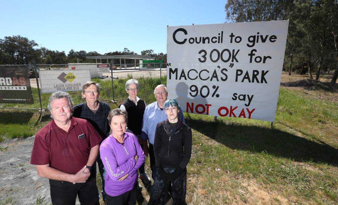 Not lovin' it: Thurgoona Community Action Group members Ian Crane, Chester Merrick, Sally Hendy, Bridget O'Connor, Graham Wade and Tracie MacVean are upset about plans for a park near a proposed McDonald's fast food restaurant in their suburb. Picture: KYLIE ESLER