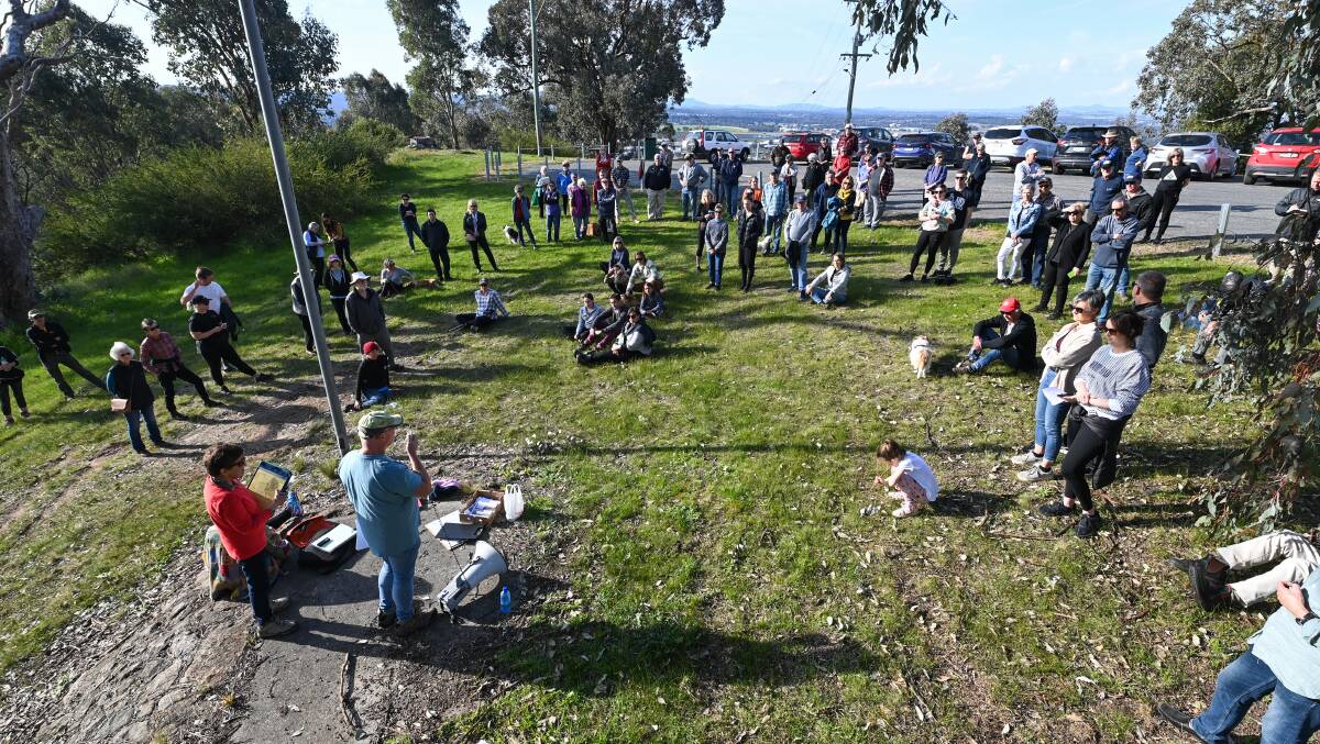 Concerned residents gather at the Eastern Hill lookout on Sunday afternoon to show their discomfort with plans for the reserve. Picture by Mark Jesser.