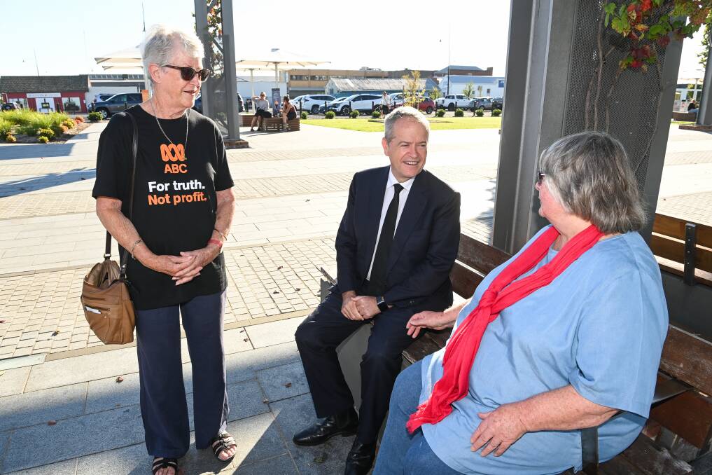 In town: Former Labor leader Bill Shorten hears from Veronica Husted and Joan Laing during his visit to Wodonga's Junction Place on Friday.