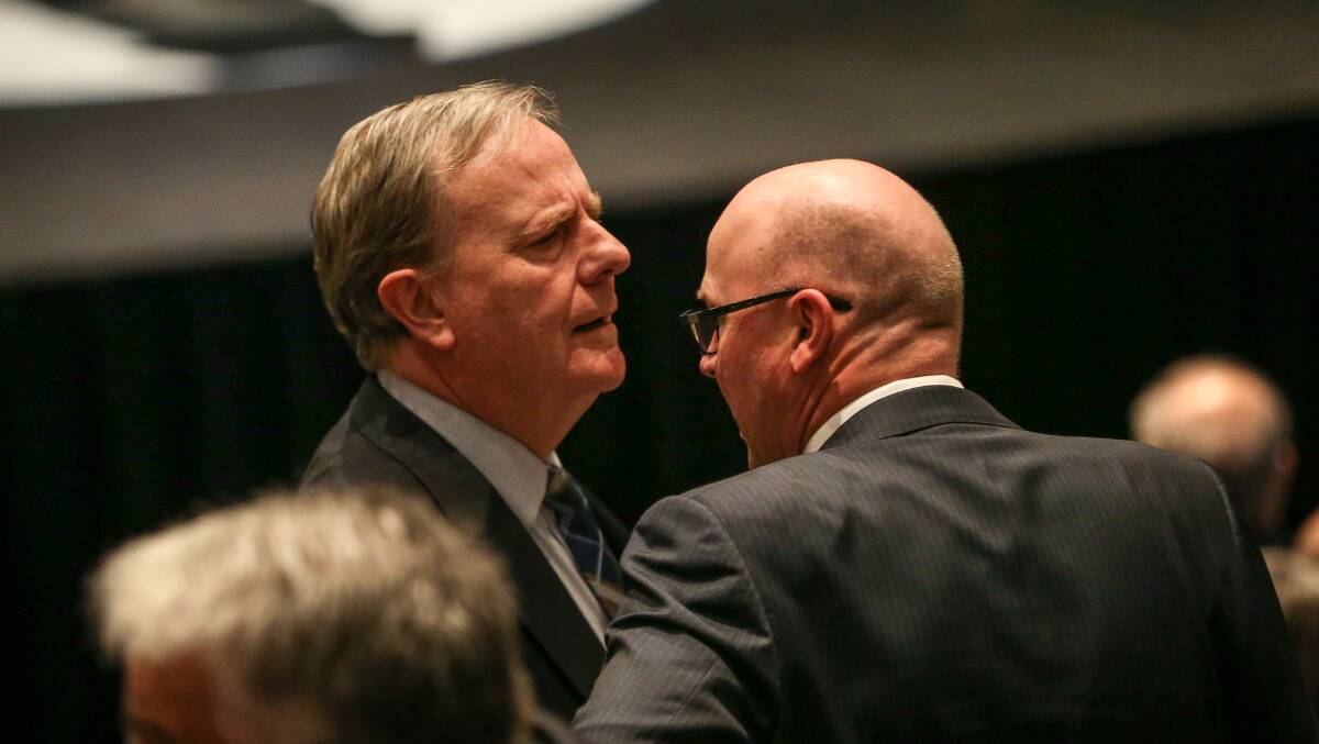 In discussion: Former treasurer Peter Costello chats to a fellow mourner before the state funeral. Picture: JAMES WILTSHIRE
