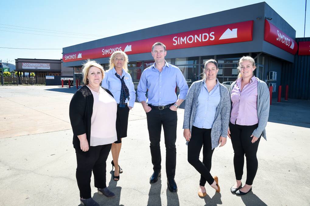 New home: Simonds workers Lisa Farrell, Anita Bourke, Luke Moriarty, Heather Brown and Shannon Stewart at their Five Ways base. Picture: MARK JESSER 