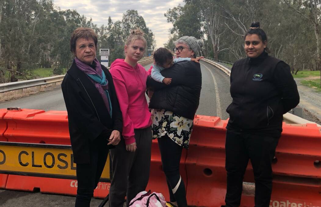 Disgruntled: The member for Murray Helen Dalton (left) with locals at the Barmah bridge crossing the Murray River which was cut off when NSW shut its Victorian border.
