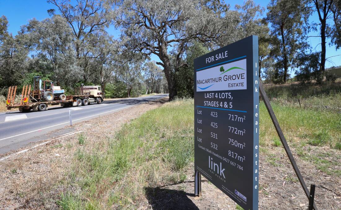 Coming or going: Trees lining Urana Road at this Hamilton Valley Estate may be removed, leaving residents fearing greater traffic noise. Picture: JAMES WILTSHIRE