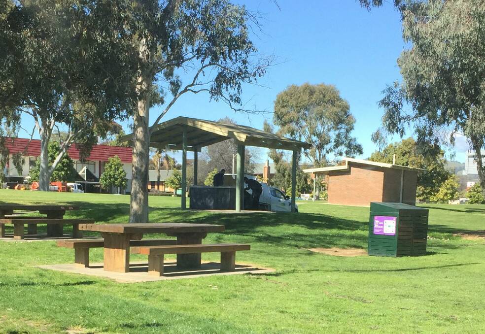 Going: Council rangers remove goods left at a barbecue in Albury's Hovell Tree Park where homeless had been gathering.