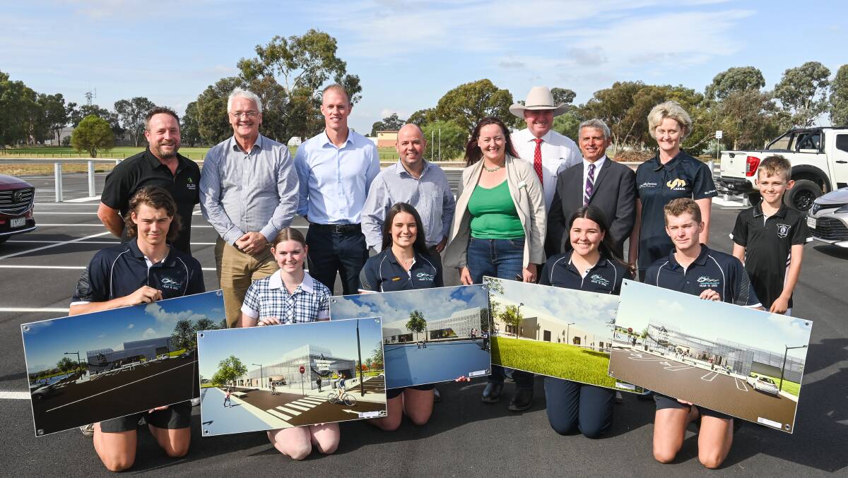Happy crew: Politicians and election candidates with students showing images of Yarrawonga's new stadium. Picture: MARK JESSER