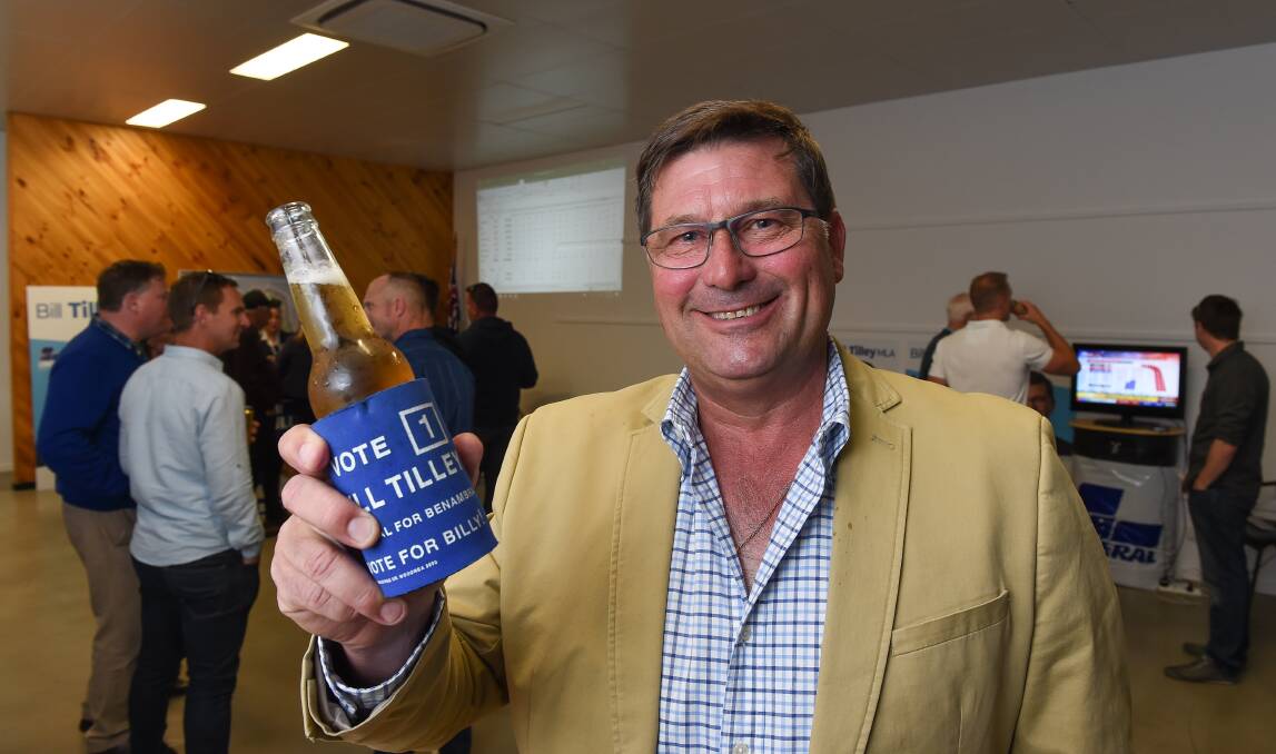 Beers not tears: Bill Tilley enjoys a beverage on Saturday night as votes flowed in from across Benambra. Picture: MARK JESSER  