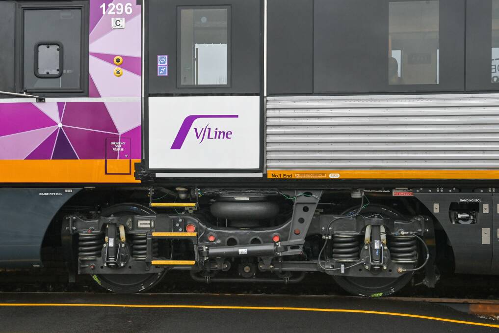 Under scrutiny: The test run train sitting at Albury's station platform on Wednesday with the damaged wheels being assessed visible to The Border Mail's photographer. Picture: MARK JESSER