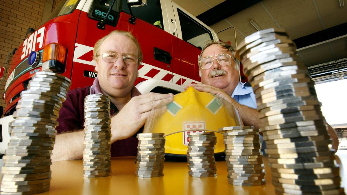 Flashback: Then Wodonga Lions Club president Graeme Taylor and Wodonga fire brigade member Neville Frichot with a fraction of the money they collected for the 2005 Good Friday Appeal.