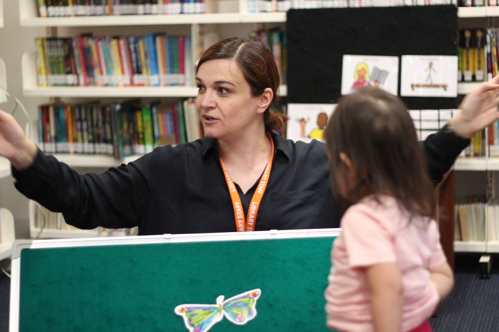 Special session: A child ponders a board that forms part of the weekly sensory session held at Deer Park library for youngsters with particular needs. Picture: BRIMBANK COUNCIL 